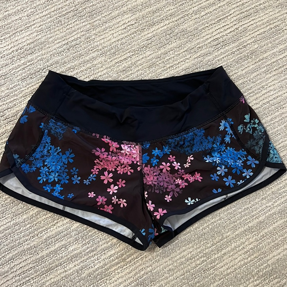 Lululemon speed shorts, black with blue, pink, aqua flower pattern - Sz 6